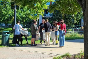 Club members meet in Bronson park to pick up trash. This was part of a volunteer activity the club organized. 