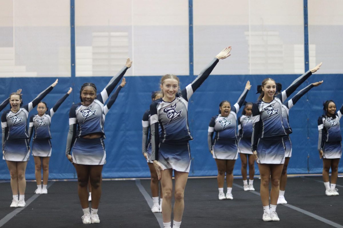 Facial expressions take over the mat as the cheer team goes through the first ten motions in the second round. Judges look very close to these ten specific motions.  

