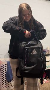 Sophomore Shyanne Weston packs her backpack at her mom's house, preparing to go to her dad’s. On Fridays, she and her brother switch parents' houses.