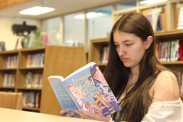 Sophomore Graciella Adams reads “The Princess and the Grilled Cheese Sandwich” by Deya Muniz. This is Adams’ favorite book that she’s read in book club.