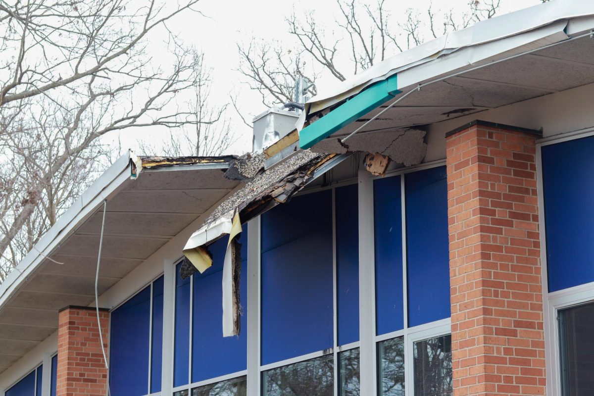 From outside the building, classroom A-12’s roof sags. Inside, the damages have been patched so it leaks less frequently.