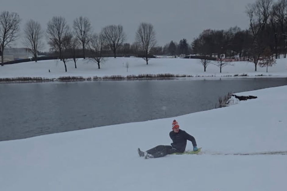 Senior Elliott Anderson enjoys a snow day at the Kalamazoo Country Club. In December, he and his friends frequently went sledding during their time off.