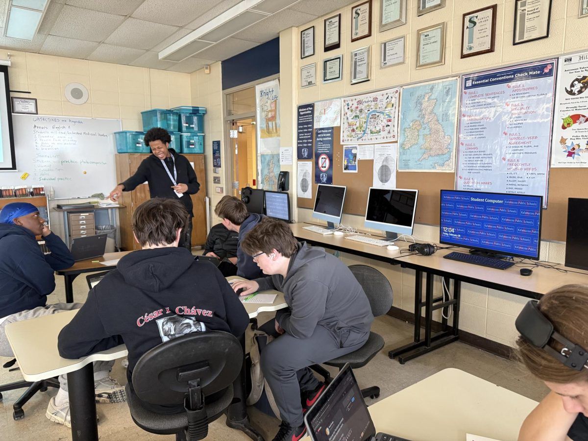 Sophomore Rashad Mitchell enjoys a good laugh with his classmates in his journalism class. “I couldn't hold back my laughter at my friend Jacob’s joke," said Mitchell.