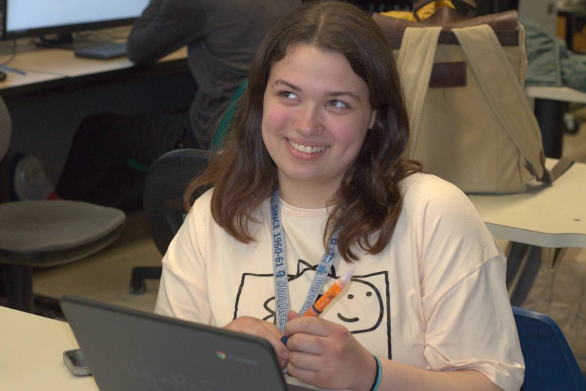 Senior Raylee Maize–Scaife debates with her Novolog insulin pen in class while talking with classmates. Diabetics have to use an insulin pen about 15 minutes before they eat or when their blood sugar is high.