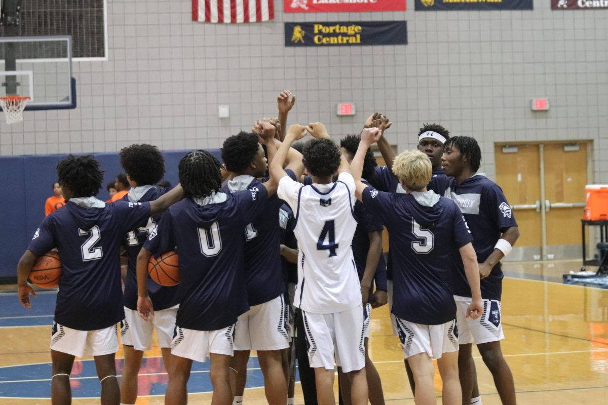 The team breaking the huddle, before the game.